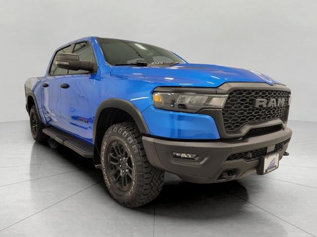 2025 RAM 1500 Rebel Crew Cab 4x4 5'7" Box in Blue — front three-quarter view